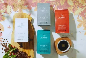 Lifeboost Coffee bags in assorted roasts with brewed cup display
