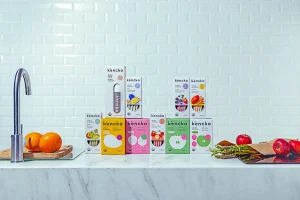 Kencko Smoothie product boxes displayed on a kitchen counter.