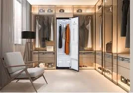 Luxury closet with open steam closet and clothes inside