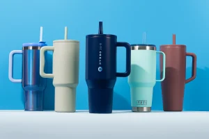Colorful Target Stanley Cup tumblers on blue background.