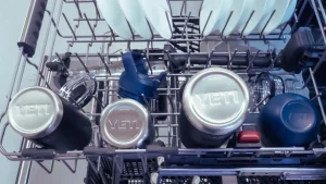 Yeti cups placed in top rack of dishwasher proving Yetis dishwasher safe design