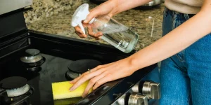Cleaning best induction range surface using spray bottle and sponge
