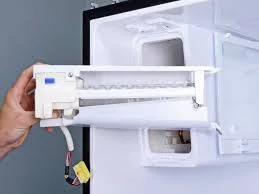 Ice maker repair in progress inside freezer