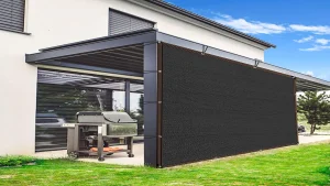 Black shade cloth attached to a modern patio structure