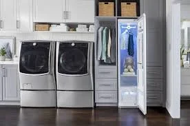 Laundry room with steam closet and washer dryer set