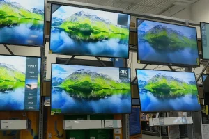 4K TVs on display in electronics store