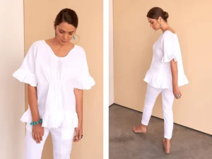 Model in a white linen wrap dress