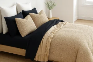 Cozy beige and navy bedding setup