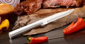 Steak knife on wood board
