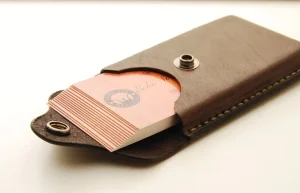 Brown leather card holder with snap closure