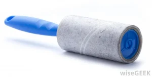 Blue handle lint roller on white background