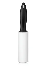 Black handle lint roller standing upright