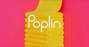 Poplin Laundry stacked yellow towels on pink background