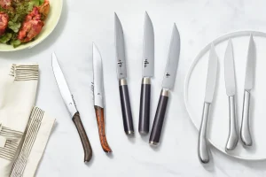 Assorted Laguiole steak knives on table