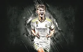 Nico Paz celebrating in Real Madrid jersey