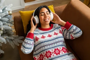 Woman relaxing and listening to Christmas Songs