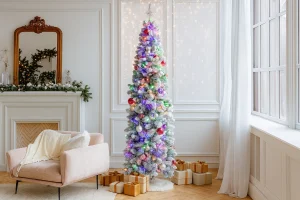 Slim flocked pencil Christmas tree in cozy room