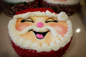 Santa-themed christmas cake with smiling design