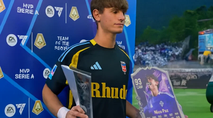 Nico Paz holding MVP trophy and FUT card at EA Sports event