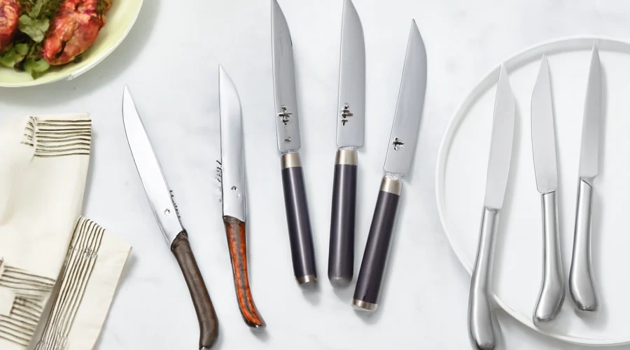 Assorted Laguiole steak knives on table